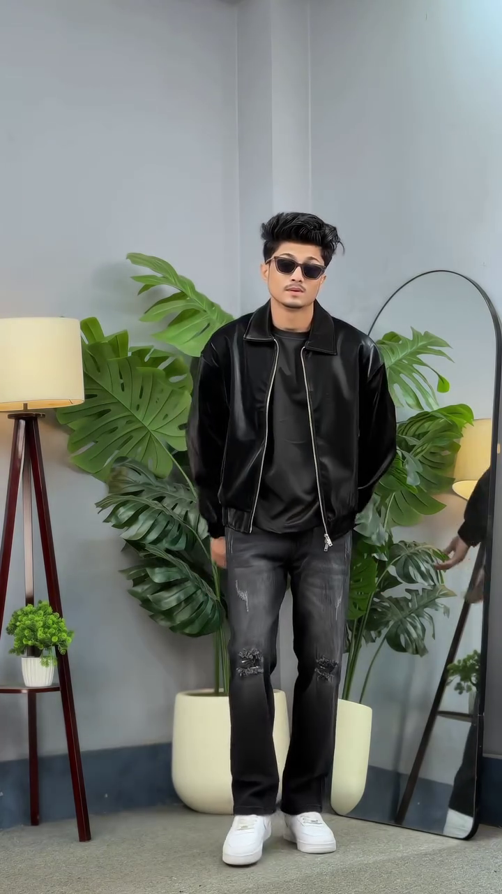 Urban Edge, Timeless Cool: The Black Faux Leather Bomber with Distressed Dark Denim